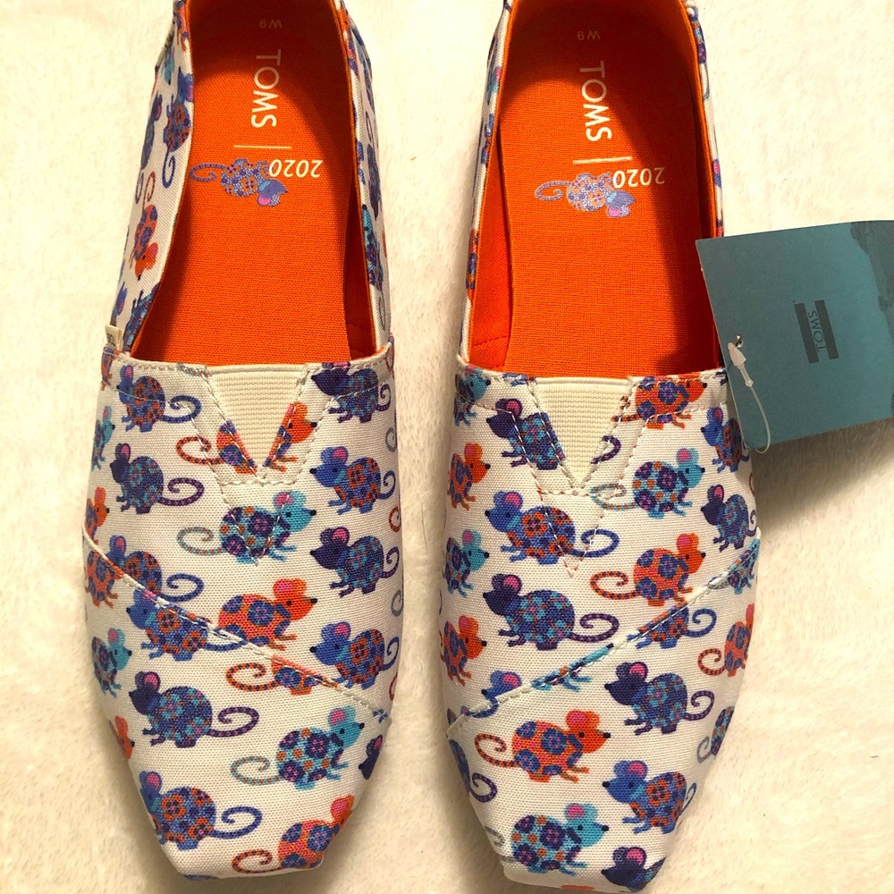 Tom’s classic Bright White Year Of the Rat shoes. Size 9. Very cute